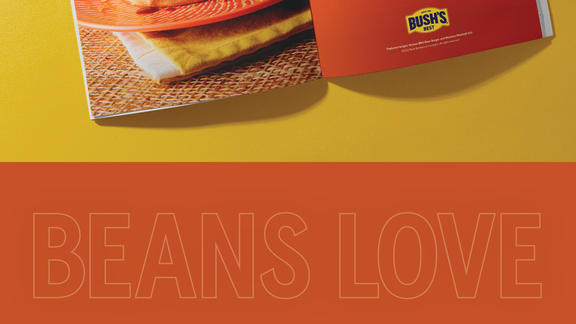 Beans love graphic type treatment in yellow on an orange background.